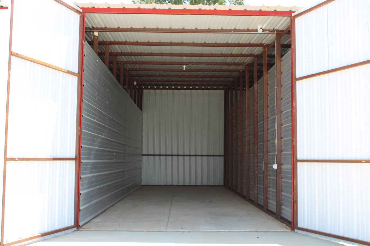 Inside a tall, deep enclosed boat stall at E-Z Boat Storage